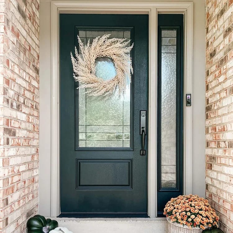 Handyman fitting hardware to a residential entry door