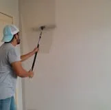 Interior painting work in progress with clean cut lines