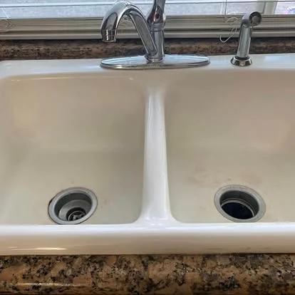 White double-basin kitchen sink before replacement